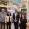 Four people standing in front of the Refugee Employment Network banner. One of them is the Lord Mayor, with a Mayor necklace on.